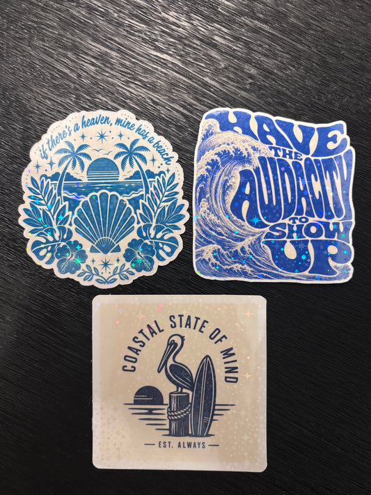 Bring the coast with you wherever you go with this holographic ocean-themed sticker 3-pack!